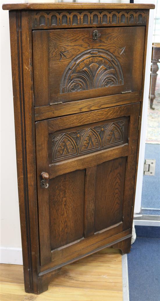 An oak corner cupboard W.68cm